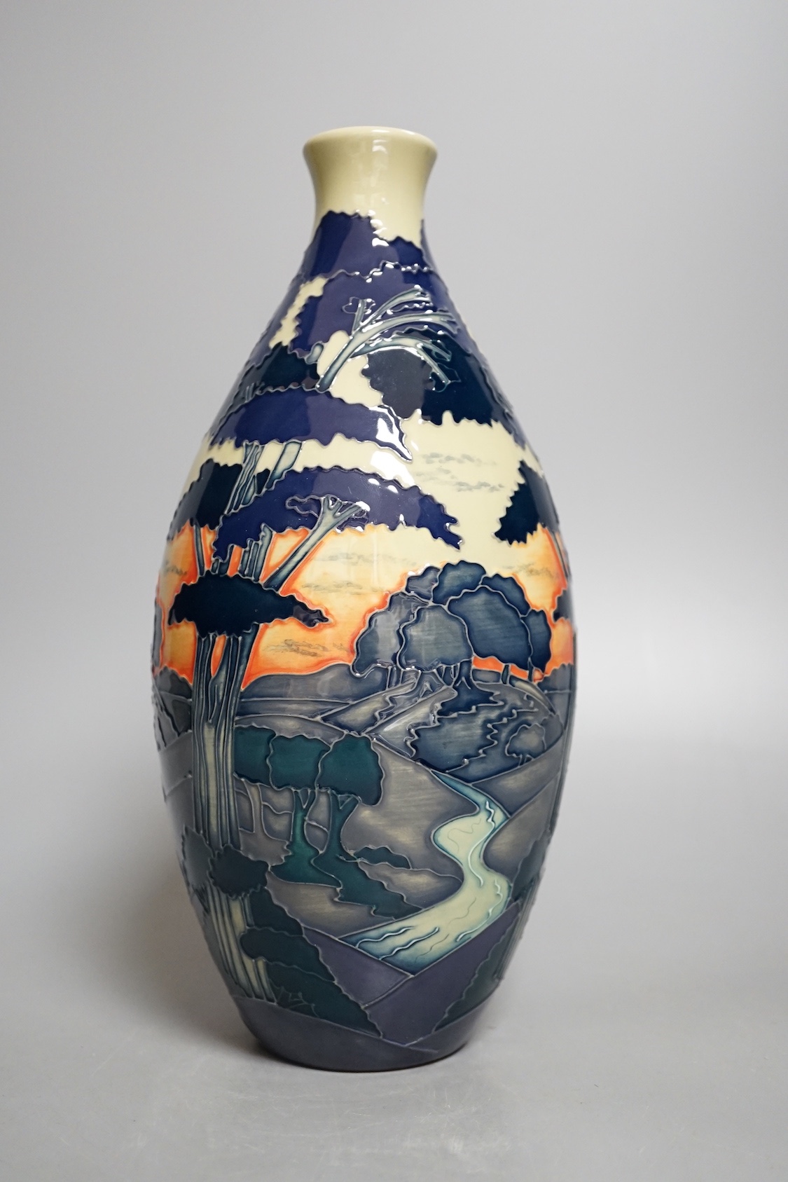 A Moorcroft 'trees in a dusky landscape' trial vase, boxed, 23.5 cms high.